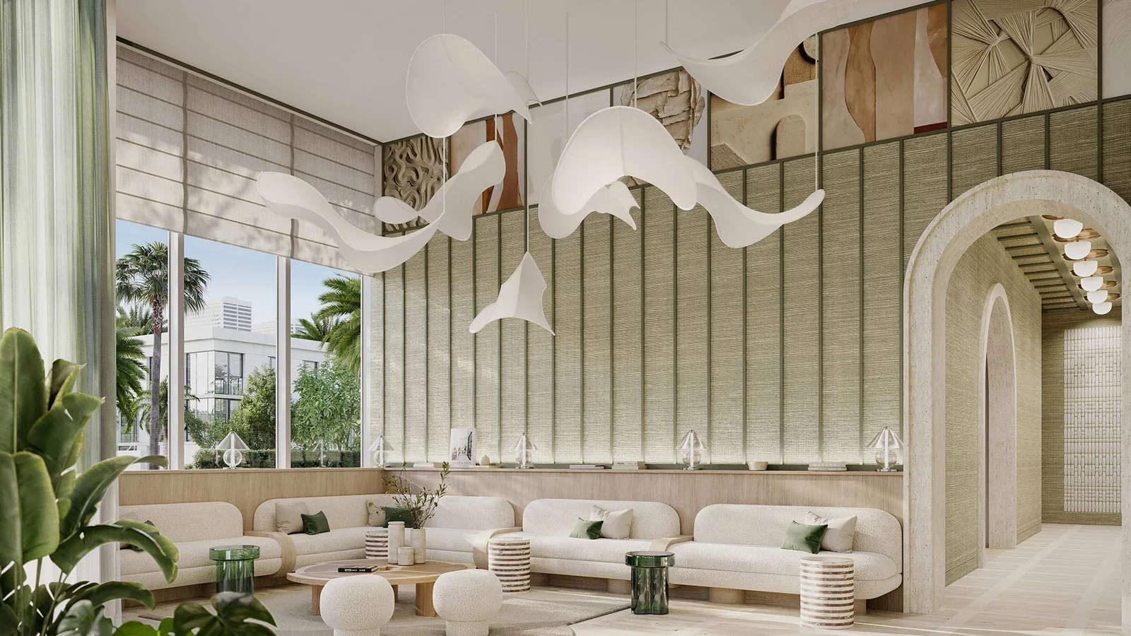 Lobby do Palma com pé-direito duplo, esculturas suspensas, arcos em travertino e sofás claros